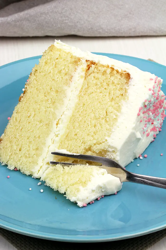 This Vanilla Cake with Whipped Cream Cheese Frosting is perfectly moist, easy and airy vanilla cake with filling made of vanilla cream cheese and heavy whipping cream.