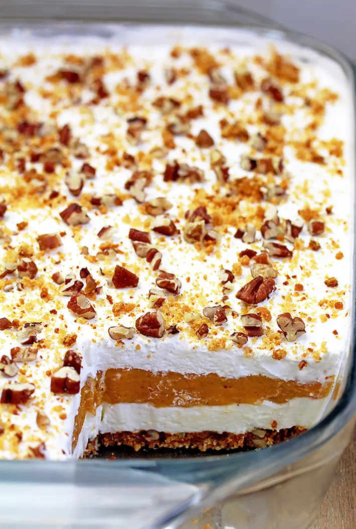 Pumpkin Lush – this fast-made, light, yet delicious creamy dessert, with cheese cream and pumpkin layers, and gingersnap cookie crust, topped with chopped pecans and gingersnap cookie crumbs, will delight all the pumpkin lovers