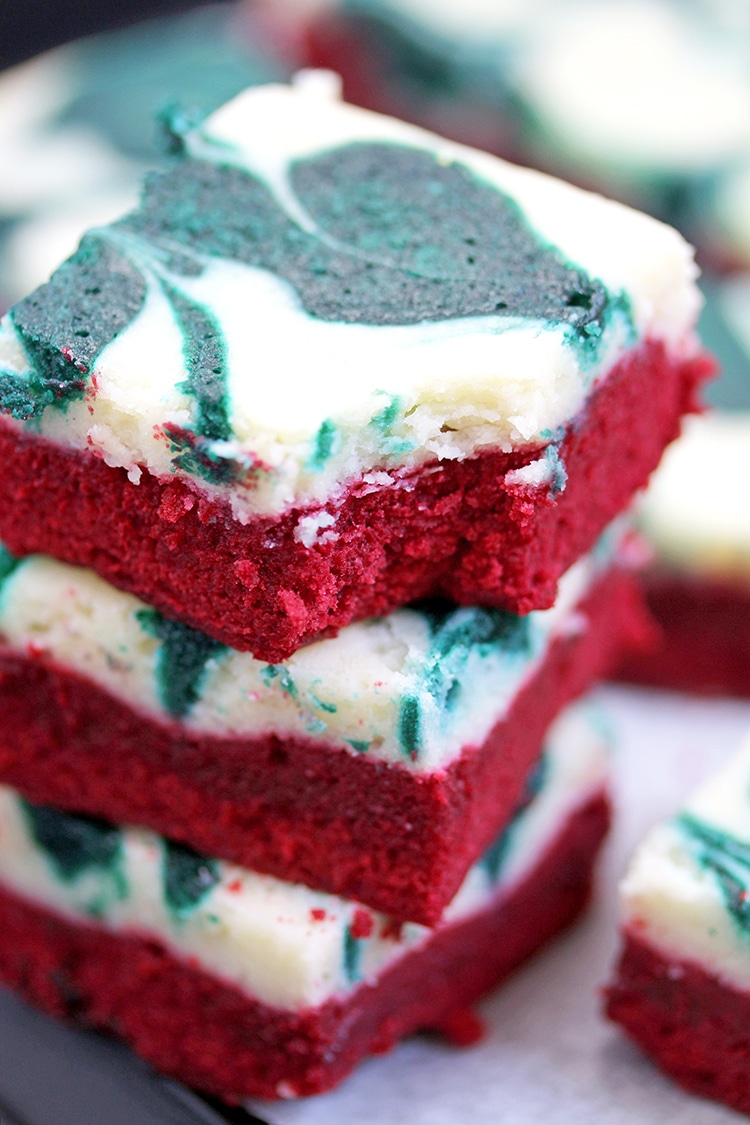 Christmas Cheesecake Swirl Brownies are quick and easy, super tasty brownies with a red velvet brownie layer, a cheesecake layer and swirl with green velvet brownies.