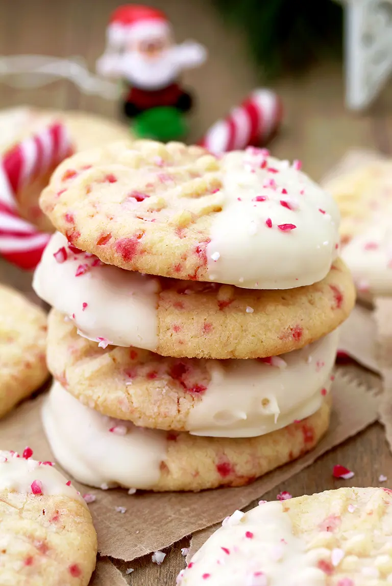 White Chocolate Dipped Candy Cane Sugar Cookies – delicious sugar cookies, just perfect for Christmas. They are easy to make and melt in your mouth. HO HO HO.. Christmas is coming and that makes me so happy.