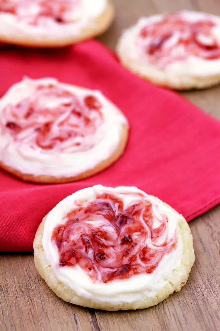 This meltaway cookies topped with cream cheese frosting and swirl with strawberry jam simply melts in your mouth.