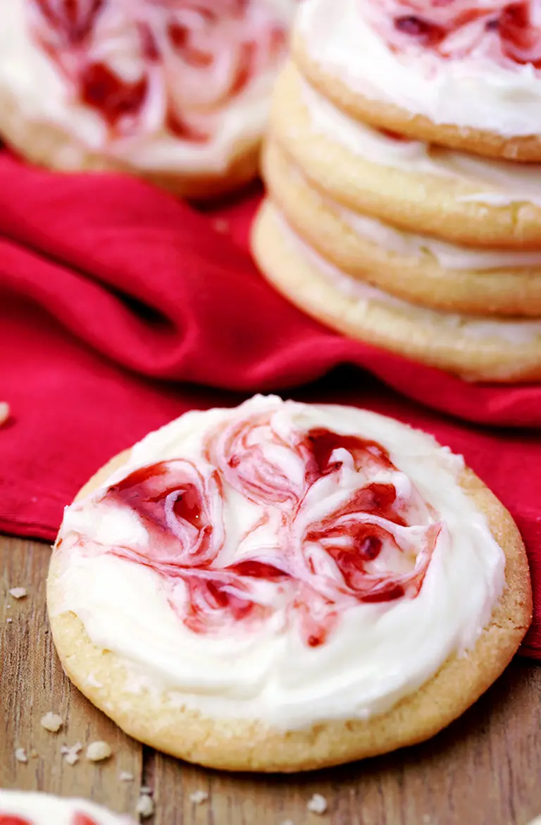 These Strawberry Cream Cheese Meltaway Cookies topped with cream cheese frosting and swirled with strawberry jam, simply melts in your mouth.