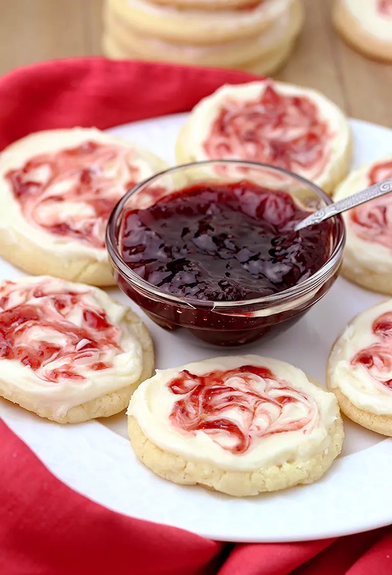 This meltaway cookies topped with cream cheese frosting and swirl with strawberry jam simply melts in your mouth.