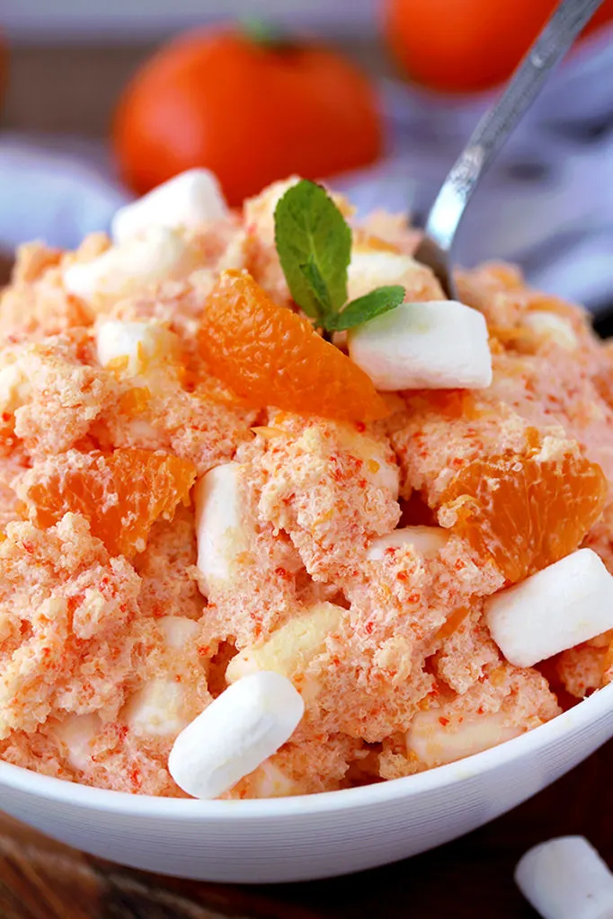 Creamsicle Orange Cheesecake Fluff Salad – this refreshing quick and easy salad is one of my favorite desserts. Cream cheese, Greek yogurt, orange juice and cool whip make this salad so creamy. Marshmallow melts in your mouth and mandarin oranges make it refreshing.