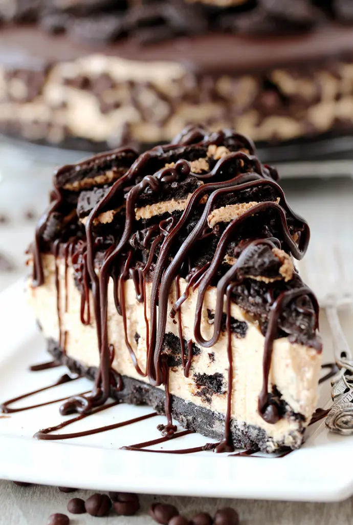 This No Bake Peanut Butter Oreo Cheesecake is a delicious dessert with peanut butter Oreo crust and peanut butter cheesecake filling, topped with chocolate ganache and crushed Oreos