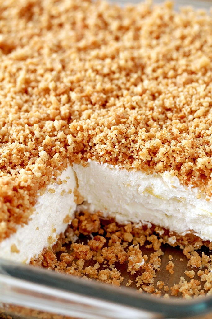 Easy Pineapple Dream Dessert a light and fluffy, quick and easy no bake creamy summer dessert. This creamy treat, made of crushed pineapple, cream cheese, butter and whipped cream and crunchy graham cracker layer, topped with graham cracker crumbs is a perfect way to sweeten hot summer days.