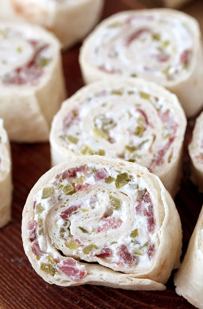 Dill Pickle Tortilla Roll Ups – these party appetizers are filled with cream cheese, sour cream, light mayo, dill pickles, dry beef, onion, ground black pepper and garlic powder, make a perfect choice for Game Day or any other party or holiday.