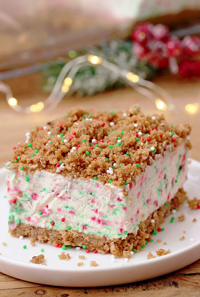 Frozen Christmas Dessert – this unique dessert has crunchy base and top and frozen, creamy filling with sprinkles in Christmas colors. A combination of filling made with cream cheese, sweetened condensed milk and whipped cream, with base and top made of graham crackers, simply has to be tried. It is so quick and easy to prepare and the taste is amazing. 