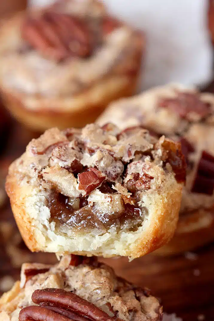 Pecan Tassies – dessert bites just perfect for Thanksgiving or Christmas. They are often called cookies because of their size, but they are closest to being called pecan pies. The dough is made of cream cheese, butter and flour mixture and they are filled with a sweet filling made of pecans, brown sugar, butter, eggs, cinnamon and vanilla. This buttery dough is unbelievably soft and makes a perfect combination with sweet filling and crunchy pecans. 