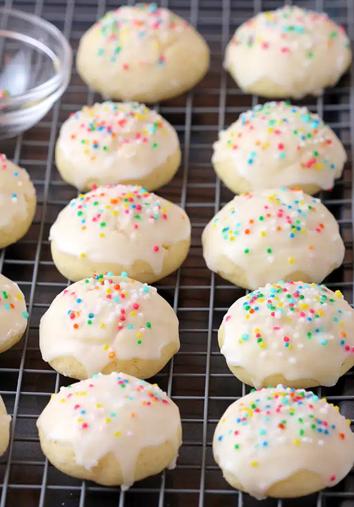 Italian Anise Cookies – soft cookies with sugar frosting and sprinkles simply melt in your mouth. These simple and very tasty holiday cookies are a perfect choice for Christmas and a great addition to your holiday cookie plate. 