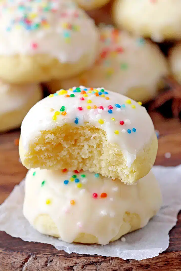 Italian Anise Cookies – soft cookies with sugar frosting and sprinkles simply melt in your mouth. These simple and very tasty holiday cookies are a perfect choice for Christmas and a great addition to your holiday cookie plate. 