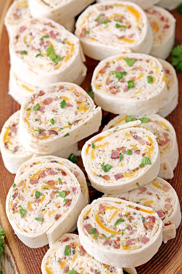 Crack Chicken Tortilla Roll Ups – is a light and tasty appetizer, perfect for every occasion. You will surely enjoy the amazing taste of these bites. Tortillas filled with cream cheese, cheddar cheese, bacon, chicken and ranch mix, are rolled, then sliced into bites and they are a perfect choice for Game Day.