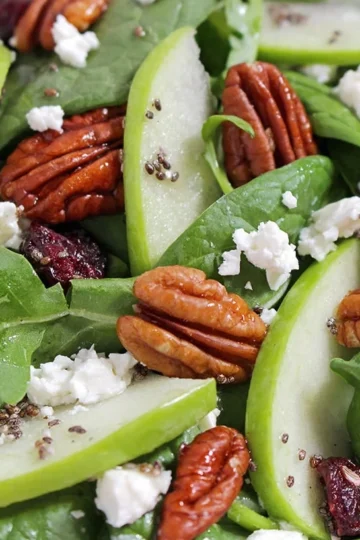 Hello everybody! Today on the menu is a healthy food - Cranberry Pecan Spinach Salad recipe rich with apples and cheese. A delightful blend of different flavors in one bowl.