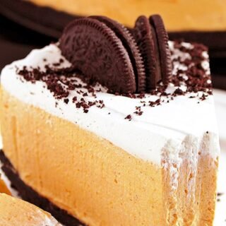 Easy No Bake Pumpkin Oreo Cheesecake so perfect for holidays and special occasions. Oreo crust, rich pumpkin cheesecake filling and whipping cream topping. Great homemade festive dessert!