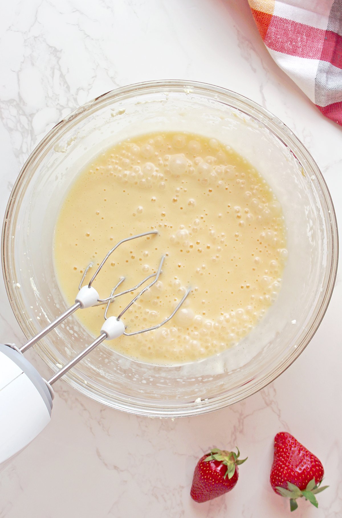 Step 3: Add the Wet Ingredients
Add eggs one at a time, then mix in vanilla extract and Greek yogurt.