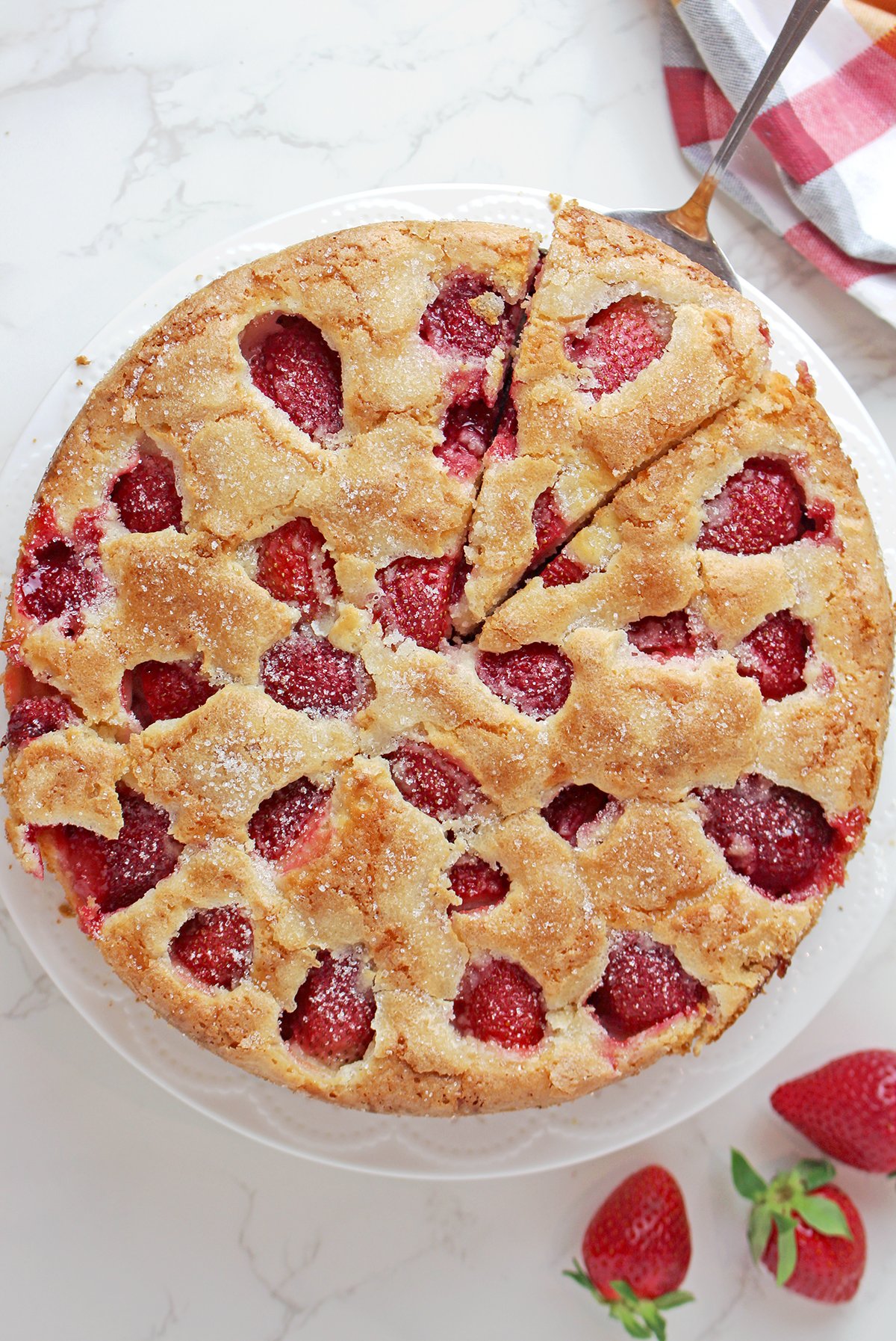 Fresh Strawberry Cream Cheese Cake is a soft, moist strawberry cake filled with fresh strawberries, cream cheese, and vanilla flavor. It’s buttery, tender, and topped with a light crackly sugar crust that adds the perfect texture contrast.