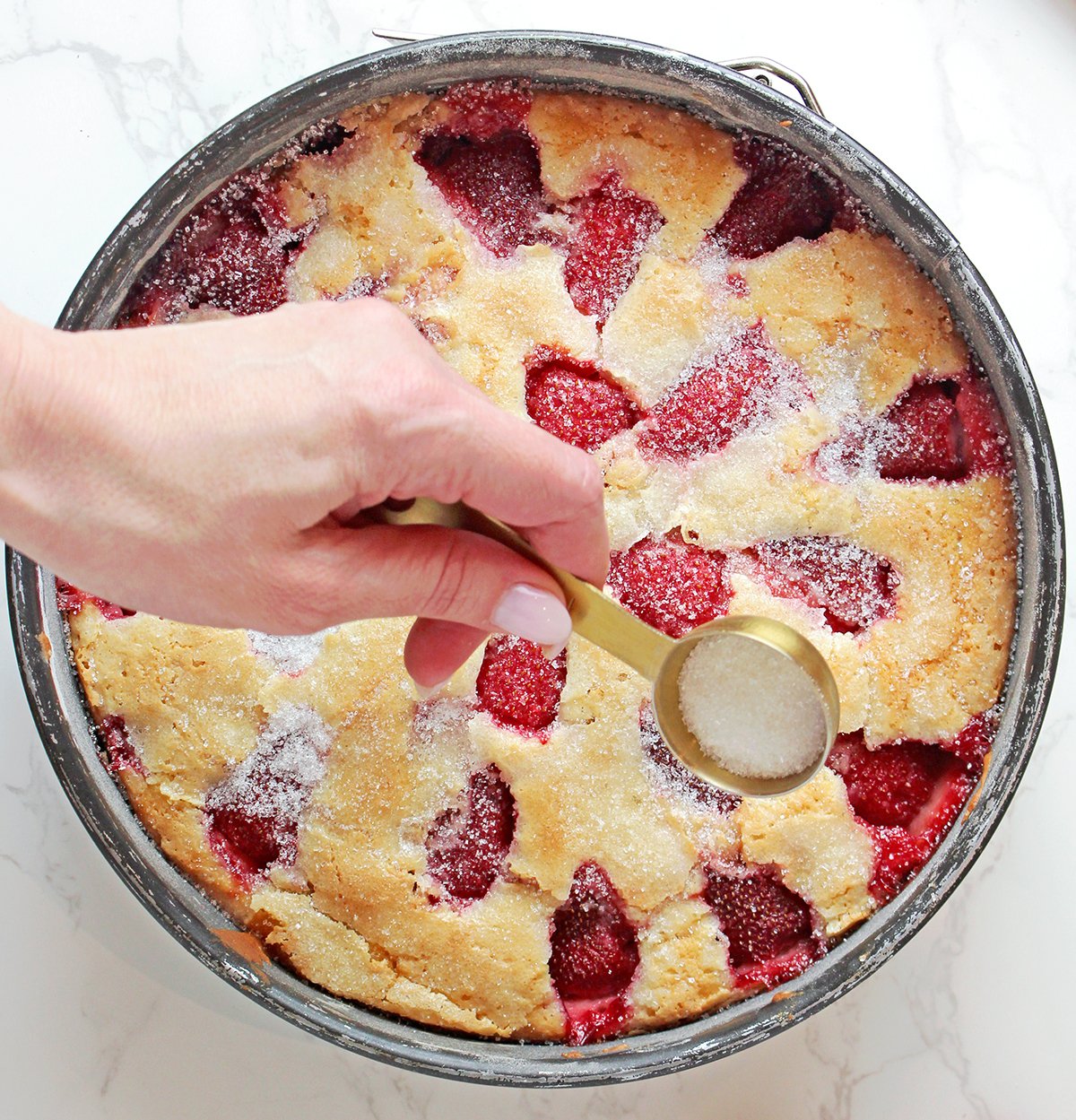Step 7: Bake, Sprinkle & Cool - Bake until golden and set in the center. Sprinkle 1 tablespoon of sugar over the baked cake. Transfer to a wire rack to cool completely.