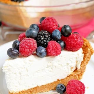 There is a crust made of graham crackers, sugar and cinnamon, then cheesecake filling made of cream cheese, heavy cream, sugar and lemon juice and fresh berries mix on the top ♥