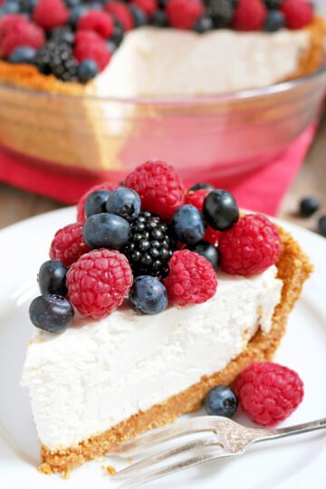There is a crust made of graham crackers, sugar and cinnamon, then cheesecake filling made of cream cheese, heavy cream, sugar and lemon juice and fresh berries mix on the top ♥