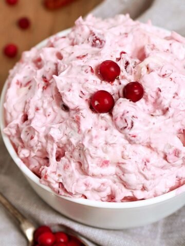 This salad is a perfect dessert for Thanksgiving Dinner or New Year‘s Eve feast. Cranberry Cheesecake Fluff Salad is quick, simple and easy to prepare ♥