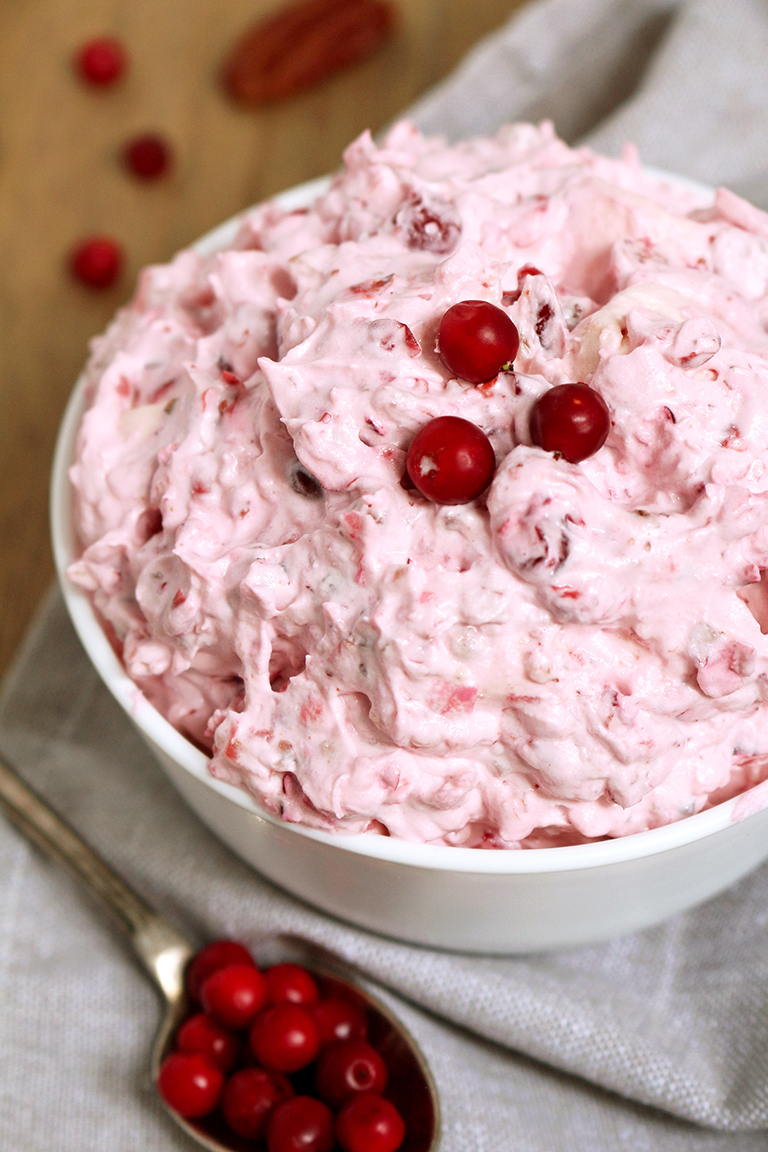 This salad is a perfect dessert for Thanksgiving Dinner or New Year‘s Eve feast. Cranberry Cheesecake Fluff Salad is quick, simple and easy to prepare.