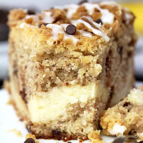 This Cheesecake Banana Bread Crumb Cake is a rich banana cake filled with cheesecake and crumb topping on the top. Start your day with this dessert and a cup of coffee or tea ?