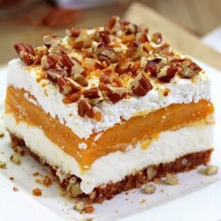 Pumpkin Lush – this fast-made, light, yet delicious creamy dessert, with cheese cream and pumpkin layers, and gingersnap cookie crust, topped with chopped pecans and gingersnap cookie crumbs, will delight all the pumpkin lovers