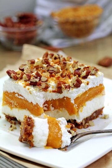 Pumpkin Lush - this fast-made, light, yet delicious creamy dessert, with cheese cream and pumpkin layers, and gingersnap cookie crust, topped with chopped pecans and gingersnap cookie crumbs, will delight all the pumpkin lovers