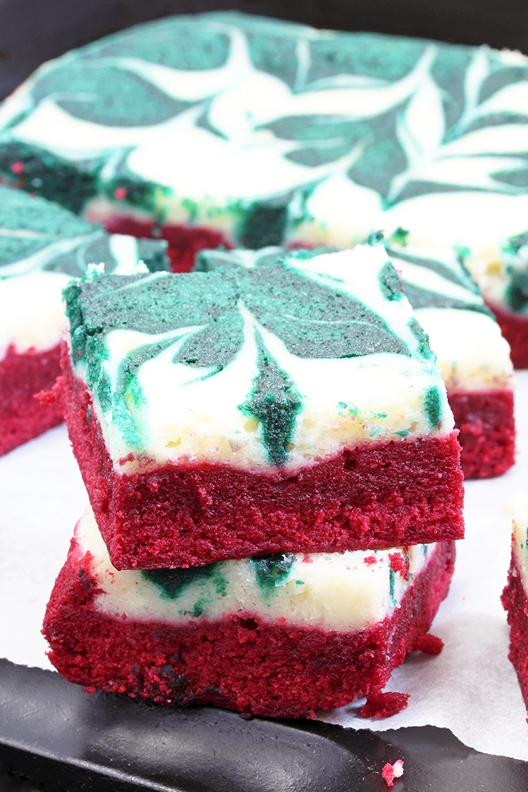 Christmas Cheesecake Swirl Brownies are quick and easy, super tasty brownies with a red velvet brownie layer, a cheesecake layer and swirl with green velvet brownies