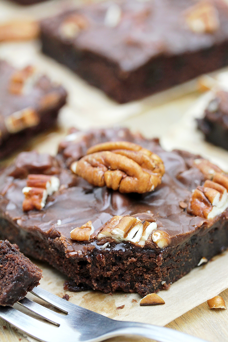 Texas Sheet Cake is thin, super moist chocolate cake, topped with warm chocolate frosting and pecans. 