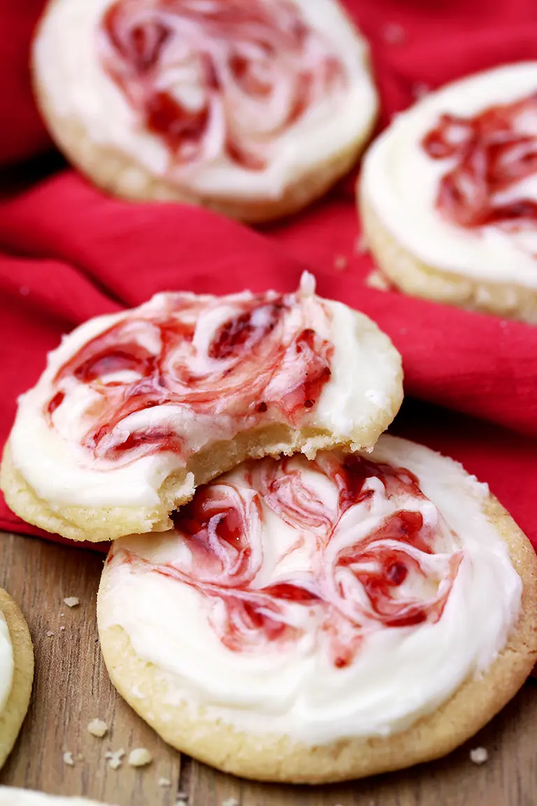 These meltaway cookies topped with cream cheese frosting and swirled with strawberry jam, simply melts in your mouth.