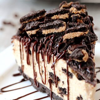 This No Bake Peanut Butter Oreo Cheesecake is a delicious dessert with peanut butter Oreo layer and peanut butter cheesecake filling, topped with chocolate ganache and crushed Oreos.