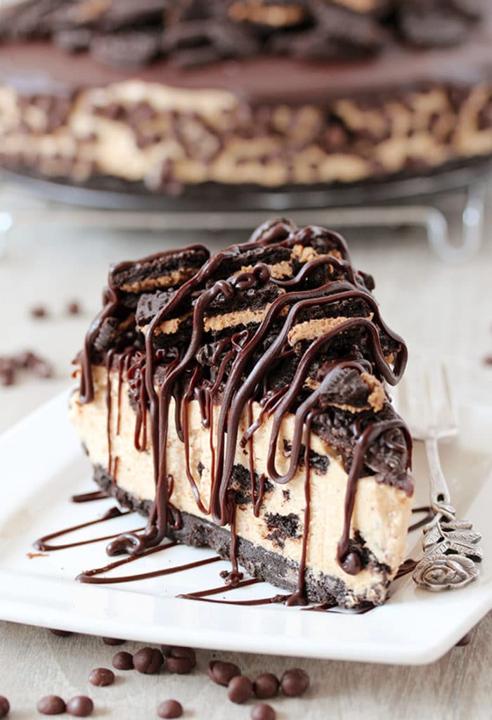 This No Bake Peanut Butter Oreo Cheesecake is a delicious dessert with peanut butter Oreo layer and peanut butter cheesecake filling, topped with chocolate ganache and crushed Oreos.