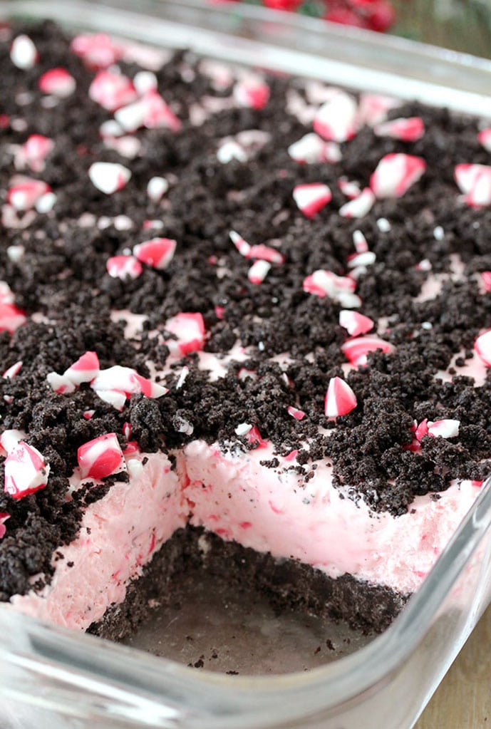 Easy Frozen Peppermint Dessert – this quick and easy holiday treat is made of peppermint candies, cream cheese, whipped cream and sweetened condensed milk, it has an Oreo layer and is topped with crushed peppermint candies and Oreos.