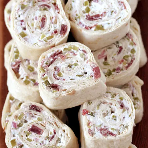Dill Pickle Tortilla Roll Ups – these party appetizers are filled with cream cheese, sour cream, light mayo, dill pickles, dry beef, onion, ground black pepper and garlic powder, make a perfect choice for Game Day or any other party or holiday.