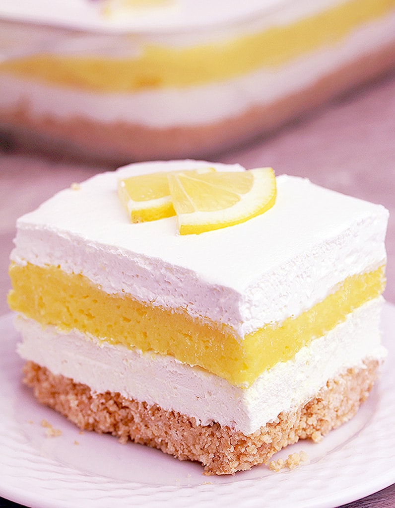 Easy Lemon Cheesecake Lasagna is a quick and simple layered dessert just perfect for Easter. Tasty Golden Oreo base, cheesecake layer, lemon pudding layer and whipped topping on top. It´s so yummy and looks great, too.