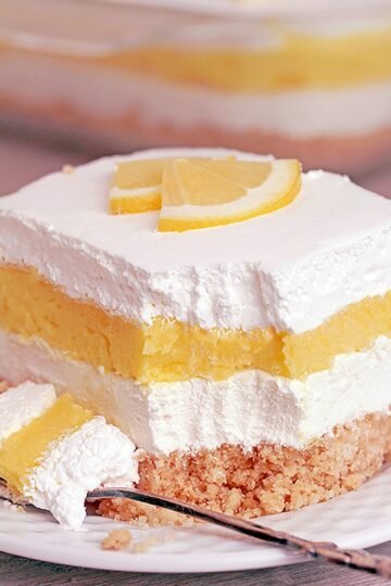 Easy Lemon Cheesecake Lasagna is a quick and simple layered dessert. What makes it so tasty is a Golden Oreo base, cheesecake layer, lemon pudding layer and whipped topping on top