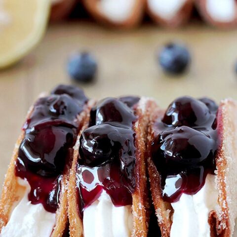 Blueberry Cheesecake Tacos – this is a recipe for very tasty dessert tacos. If you ask me, crunchy tortilla shells, filled with cheesecake filling and topped with homemade blueberry sauce make a perfect dessert.
