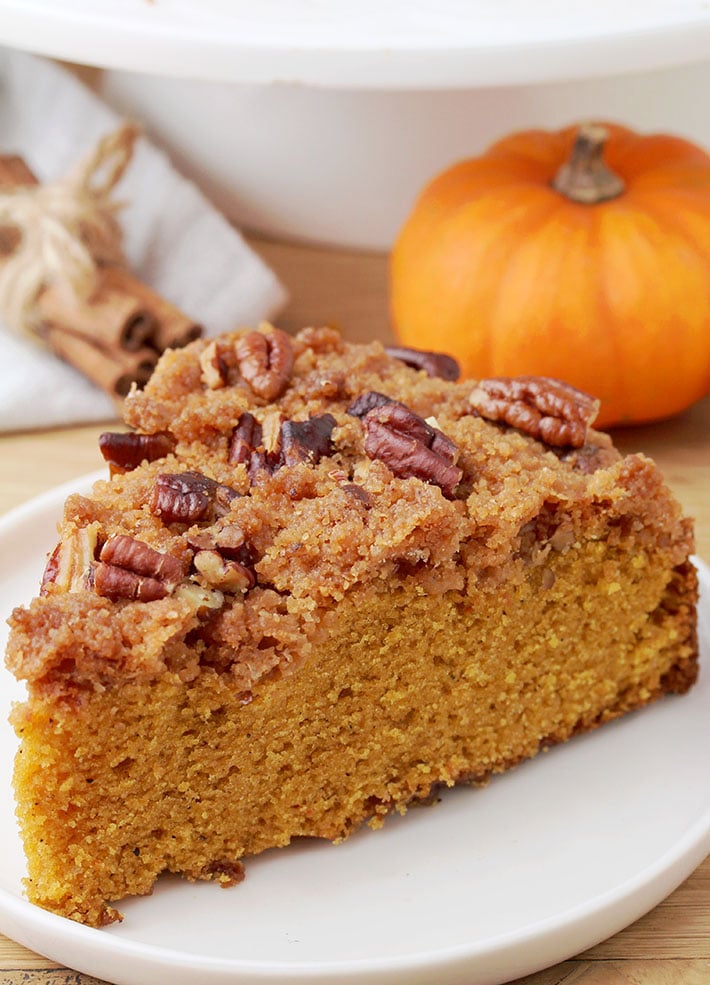 This Easy Pecan Pumpkin Coffee Cake is just perfect for breakfast or brunch with a cup of coffee, in fall. It is soft and moist, made of pumpkin and topped with crunchy brown sugar, cinnamon and pecan topping – so simple and yet incredibly delicious.