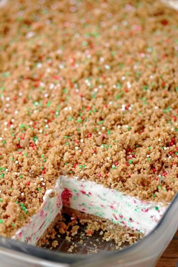 Frozen Christmas Dessert – this unique dessert has crunchy base and top and frozen, creamy filling with sprinkles in Christmas colors. A combination of filling made with cream cheese, sweetened condensed milk and whipped cream, with base and top made of graham crackers, simply has to be tried. It is so quick and easy to prepare and the taste is amazing.