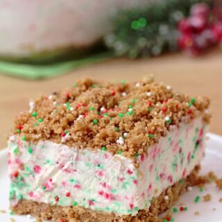 Frozen Christmas Dessert – this unique dessert has crunchy base and top and frozen, creamy filling with sprinkles in Christmas colors. A combination of filling made with cream cheese, sweetened condensed milk and whipped cream, with base and top made of graham crackers, simply has to be tried. It is so quick and easy to prepare and the taste is amazing.