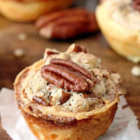 Pecan Tassies – dessert bites just perfect for Thanksgiving or Christmas. They are often called cookies because of their size, but they are closest to being called pecan pies. The dough is made of cream cheese, butter and flour mixture and they are filled with a sweet filling made of pecans, brown sugar, butter, eggs, cinnamon and vanilla. This buttery dough is unbelievably soft and makes a perfect combination with sweet filling and crunchy pecans.