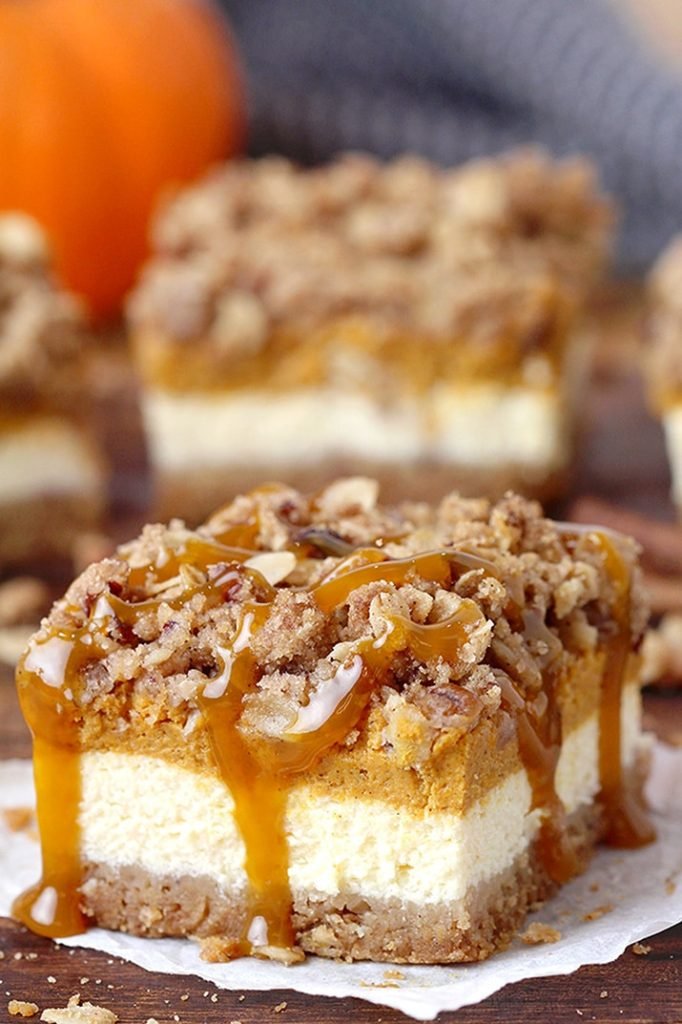 Pumpkin Cheesecake Bars – this holiday dessert with graham crackers and pecan crust, classical creamy cheesecake layer, pumpkin cheesecake layer and streusel topping with oats and pecans will fulfill all your expectations. It’s a perfect Thanksgiving dessert.