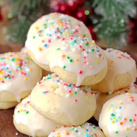 Italian Anise Cookies – soft cookies with sugar frosting and sprinkles simply melt in your mouth. These simple and very tasty holiday cookies are a perfect choice for Christmas and a great addition to your holiday cookie plate.