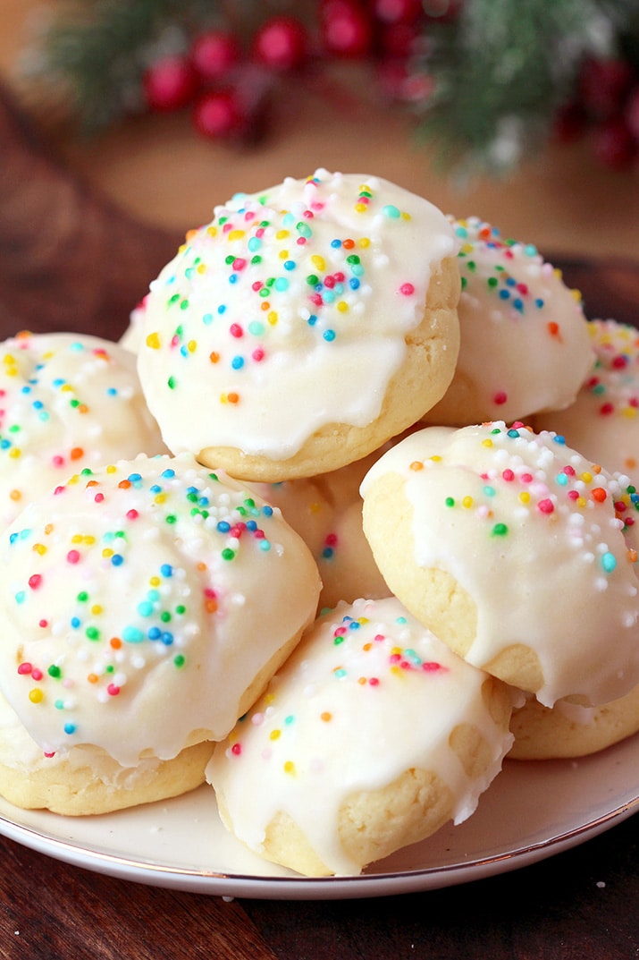 Italian Anise Cookies – soft cookies with sugar frosting and sprinkles simply melt in your mouth. These simple and very tasty holiday cookies are a perfect choice for Christmas and a great addition to your holiday cookie plate. 