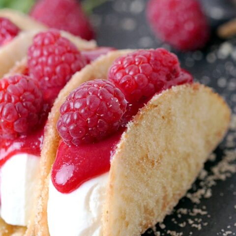 Raspberry Cheesecake Tacos – crunchy tortilla shells, creamy cheesecake filling, topped with raspberry sauce and fresh raspberries on top make this amazing dessert. These incredible bites are perfect for holidays, parties and other events. They are so quick and easy to make and they will quickly disappear from your dessert plate, so be ready to make them over and over again.