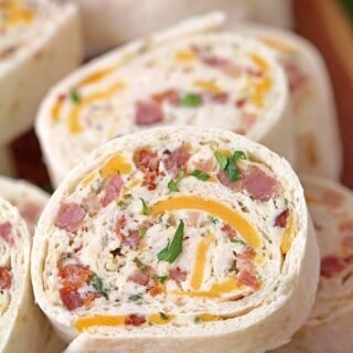 Crack Chicken Tortilla Roll Ups – is a light and tasty appetizer, perfect for every occasion. You will surely enjoy the amazing taste of these bites. Tortillas filled with cream cheese, cheddar cheese, bacon, chicken and ranch mix, are rolled, then sliced into bites and they are a perfect choice for Game Day.