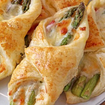 These Prosciutto Asparagus Puff Pastry Bundles are one of the easiest and most delicious appetizers I have ever made and they will surely knock you off your feet. Prosciutto, fresh asparagus, mozzarella and parmesan are all tucked in a flaky, buttery puff pastry and have a very rich taste.