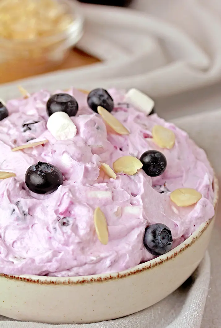 Blueberry Cheesecake Fluff Salad – quick and easy make – ahead dessert salad, made with 7 basic ingredients in 10 minutes is perfect for potluck, picnic, barbecue or holidays. It’s a cold, refreshing treat perfect for hot summer days.