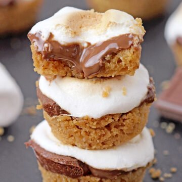 S’ mores Bites – only 5 ingredients and 18 minutes of your time is everything you need to make these incredibly delicious bite – size treats. Mini buttery graham crackers cups, melted Hershey chocolate inside, topped with gooey toasted marshmallows – a perfect combination!